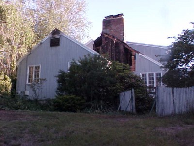 A fire last year caused extensive damage to this home on Deefroot Road. A ladder truck from Westborough was called in to assist.