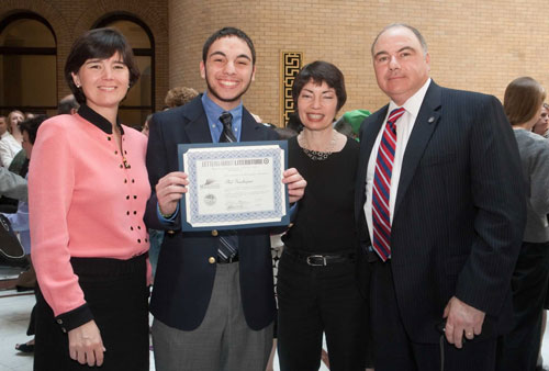 Philip Kachajian receiving his award at the State House with Representative Carolyn Dykema (left).