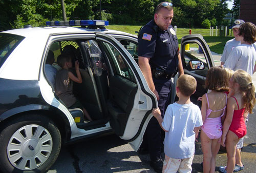 Officer Landry visiting kids at playground camp (photo courtesy of the Recreation Department)