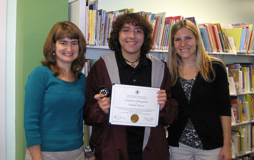 Children's Librarian Kim Ivers, volunteer Nick D'Errico, and Children's Assistant Jenn Low