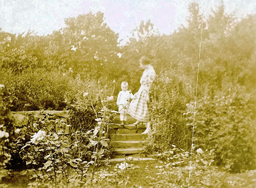 Lady and young boy on steps into Kidder sunken garden