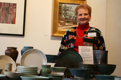 Judy Badavas shows off her hand-made pottery