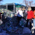 Volunteers from SEF and other charities collect recycled cans at the Transfer Station for redemption