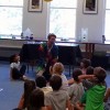 Sciencetellers entertained and educated a past summer at the Library (image cropped from Facebook)