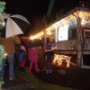 Girl Scout families singing holiday songs in the rain (2012 photo by Joao Melo)