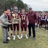 ARHS Football takes back Thanksgiving Day trophy, with former coach Dick Walsh (cropped from tweet by @ARHSAthletics)