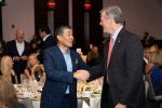 NECC Board Chair John Y. Kim and Governor Baker (from Facebook) 