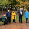 School Committee Vice Chair Roger Challen speaking at bench dedication ceremony for Kim Tolander - image cropped from photo by Ryan Donovan