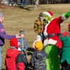 Everyone's favorite Christmas villain surprises the crowd at 2024 Southborough Santa Day (photo by Owen Jones Photo)